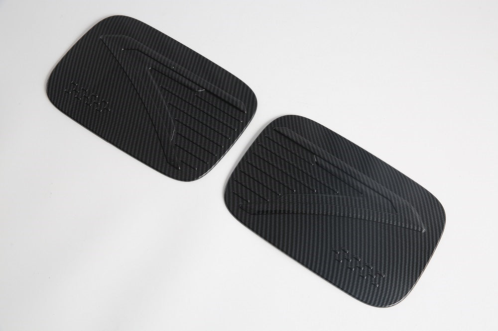 Black carbon fiber texture patterned door sill protectors for car interior protection.
