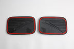 Black carbon fiber texture door sill protector plates with distinctive red trim edges.