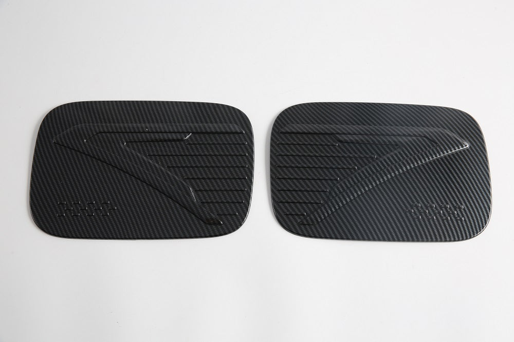 Black carbon fiber texture paddle shifter covers for BYD, featuring a sleek patterned finish.