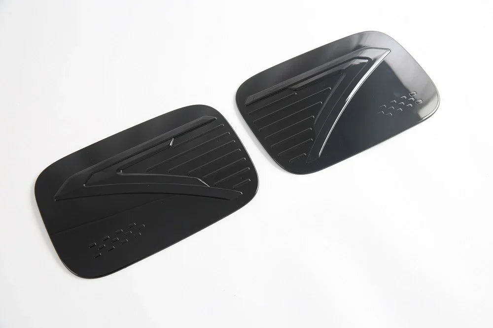 Glossy black ABS plastic side mirror covers with aerodynamic textured design.