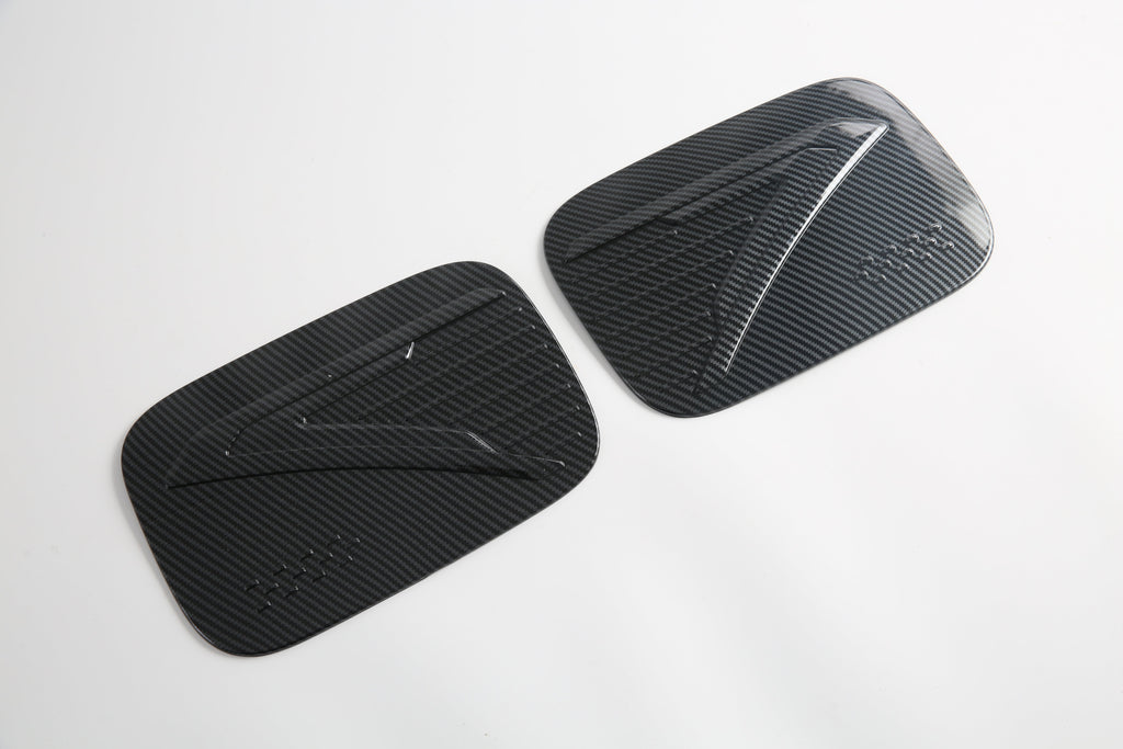 Pair of sleek black carbon fiber decorative door trim covers for BYD vehicles.