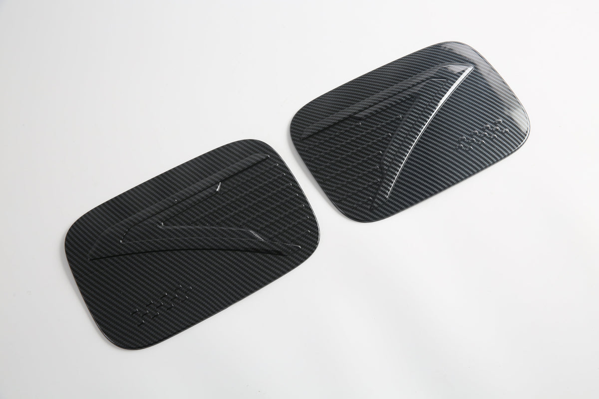 Pair of sleek black carbon fiber decorative door trim covers for BYD vehicles.