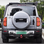 Rear view of a silver BYD Fangchengbao hard-shell spare tire cover and rugged SUV exterior.