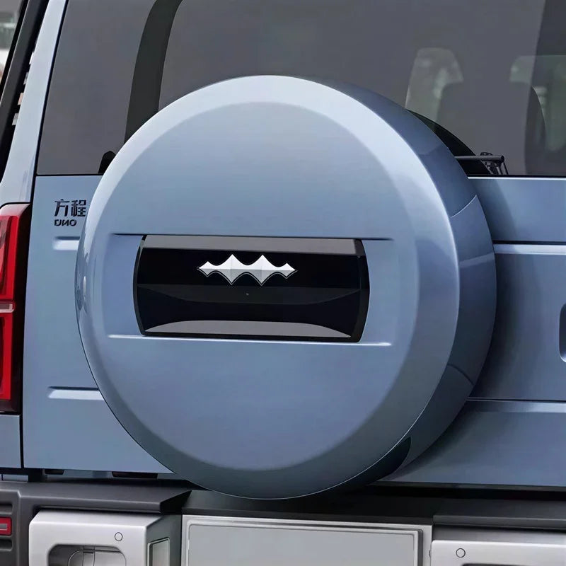 Light blue hard-shell spare tire cover with a sleek black central decorative accent.