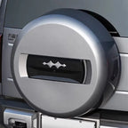Silver metallic spare tire cover with a sleek black central accent for BYD models.