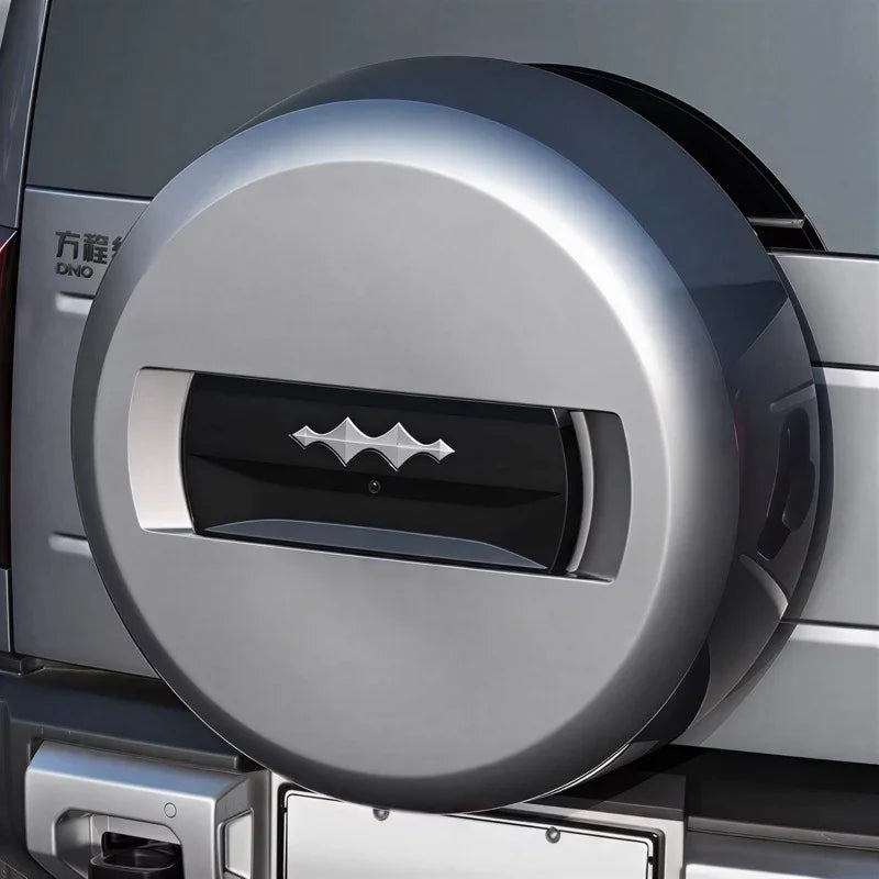 Silver metallic spare tire cover with a sleek black central accent for BYD models.
