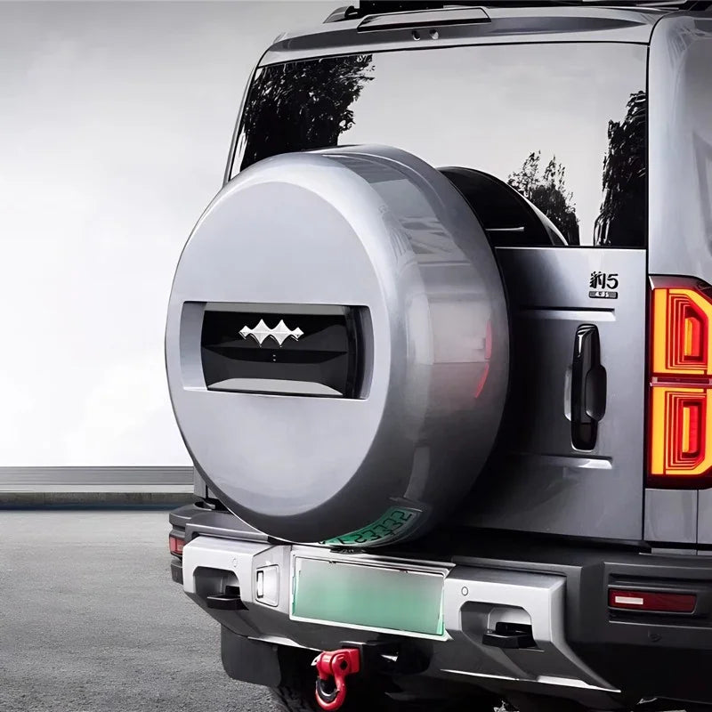 Silver metallic hard-shell spare tire cover for BYD Yangwang U5 off-road protection.