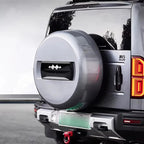 Silver metallic hard-shell spare tire cover for BYD Yangwang U5 off-road protection.