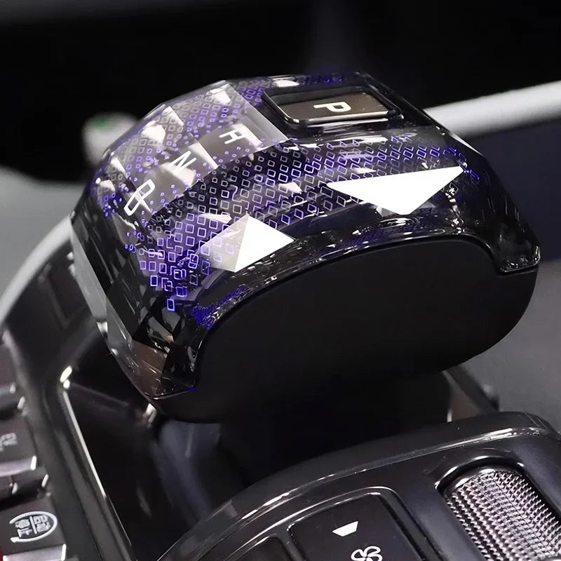 Black patterned crystal gear shifter knob with blue LED light effects for BYD interior.