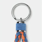 Braided blue and orange suede leather keychain with a polished silver metal ring.