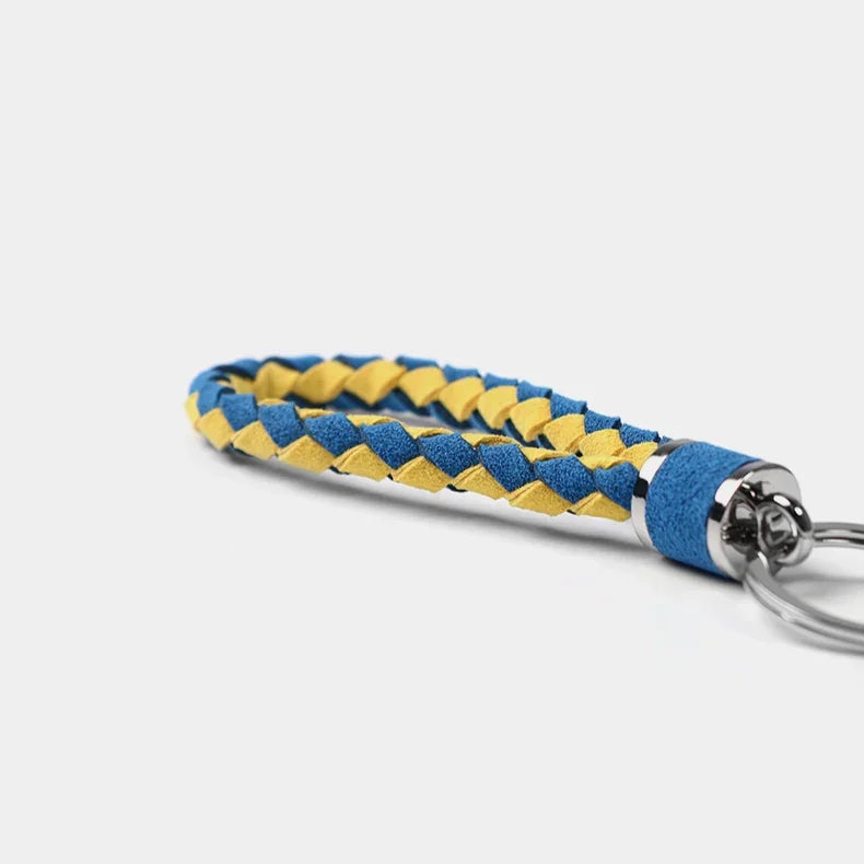 Braided blue and yellow leather keychain with a durable metallic ring.