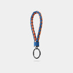 Braided blue and orange leather keychain with a polished silver metal ring.
