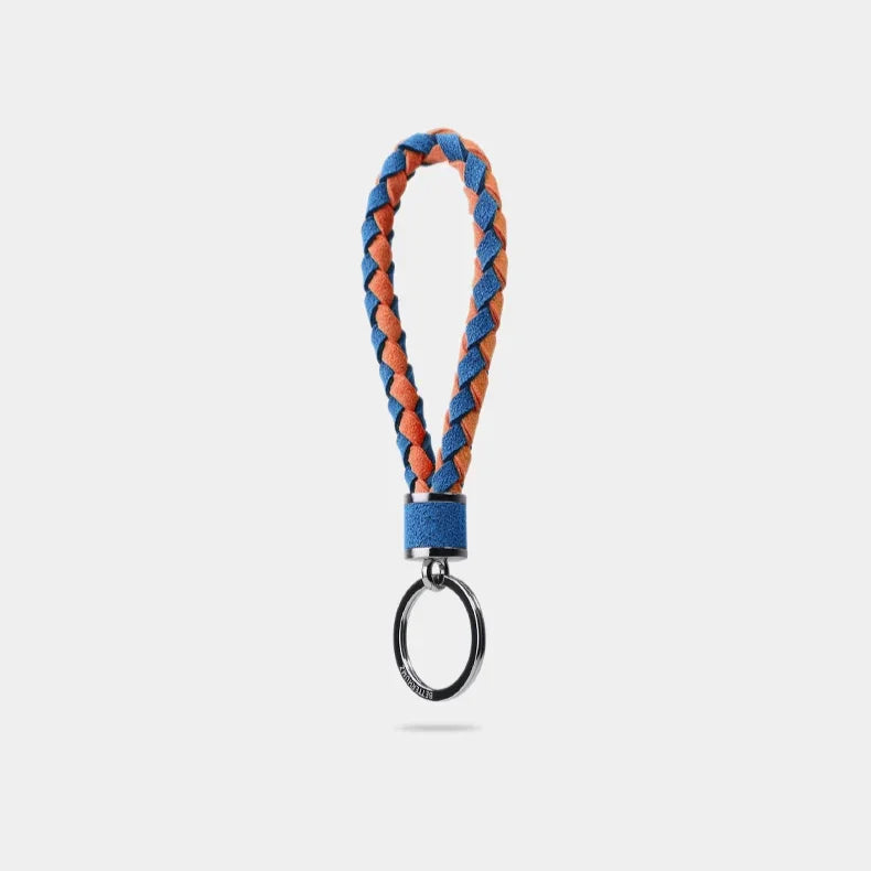 Braided blue and orange leather keychain with a polished silver metal ring.