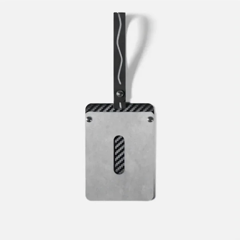 Silver metal car accessory with carbon fiber accents and a black strap.