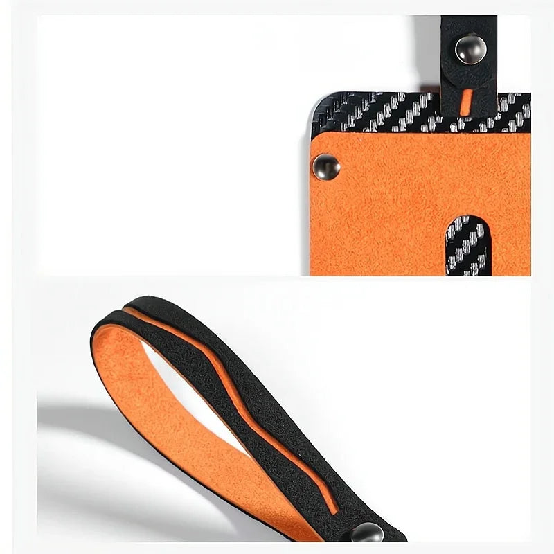 Orange felt and black carbon fiber pattern car floor mat accessory with durable stitching.