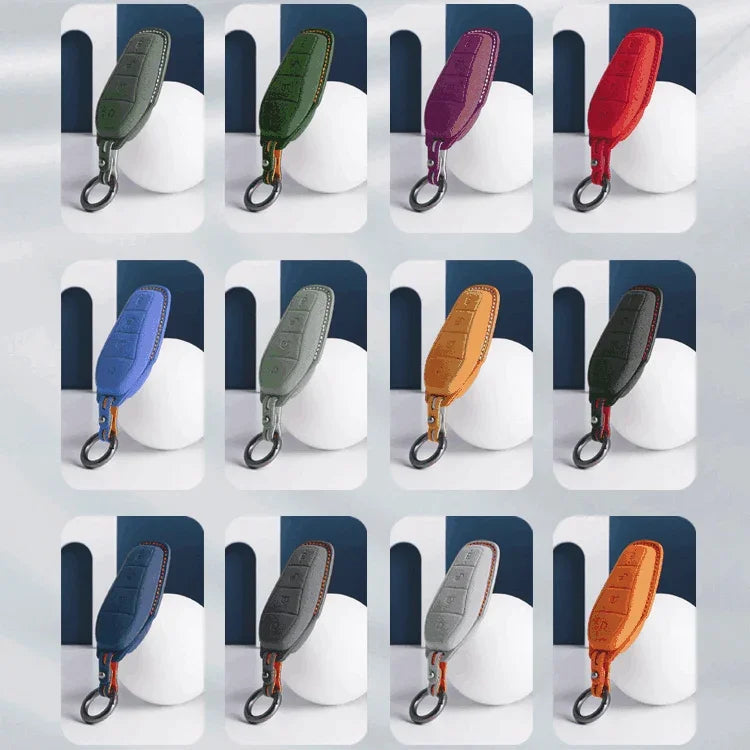 Assorted premium leather car key fob covers in multiple colors with contrast stitching.