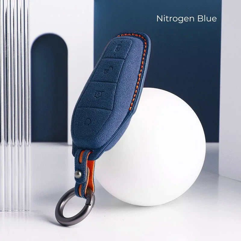 Nitrogen Blue premium leather car key fob cover with contrasting orange stitching.