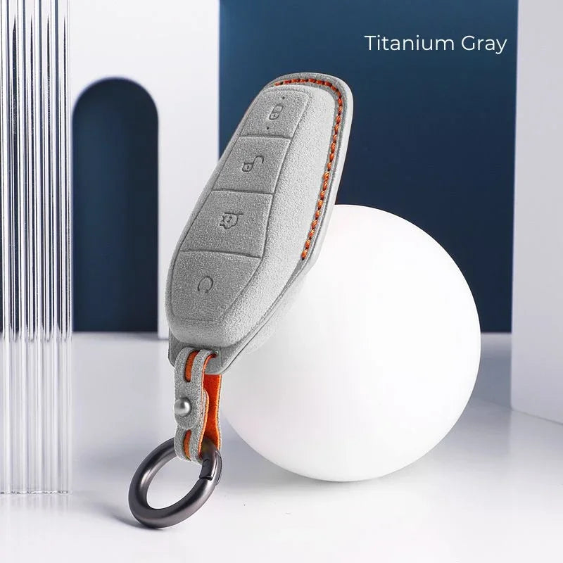 Titanium Gray microfiber suede car key fob cover with contrast orange stitching.
