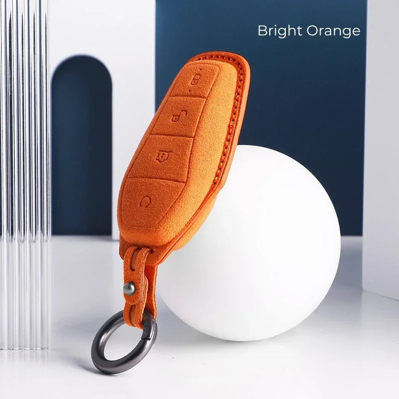 Bright orange premium suede leather car key fob cover with metal ring keychain.