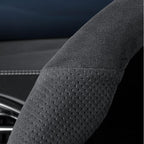 Black perforated suede steering wheel cover for enhanced grip and durability.