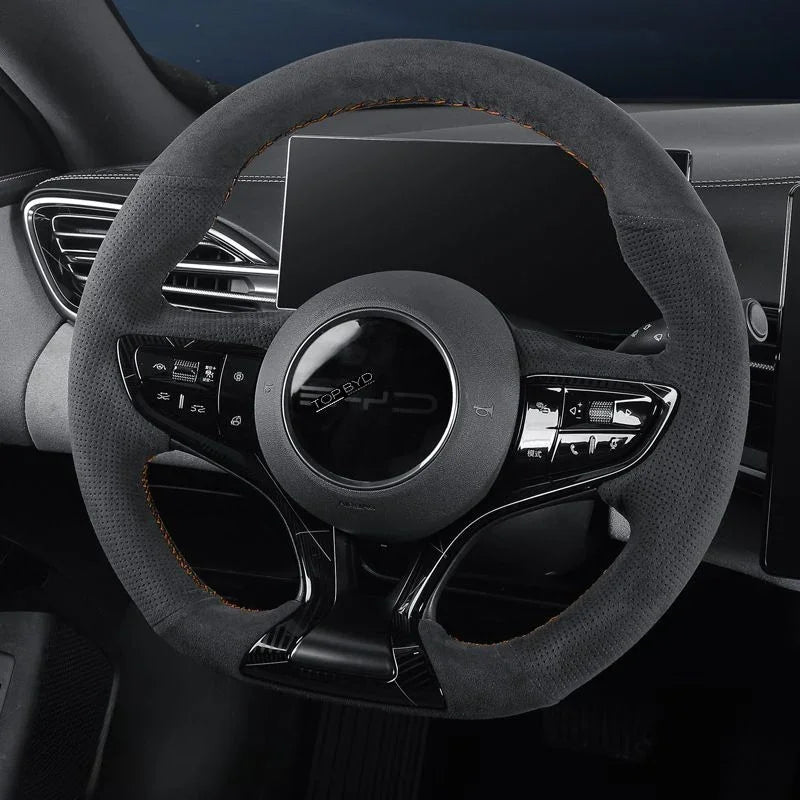 Black suede steering wheel cover with orange contrast stitching for BYD interior protection.