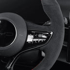 Black perforated leather steering wheel cover with red stitching for BYD aftermarket upgrade.