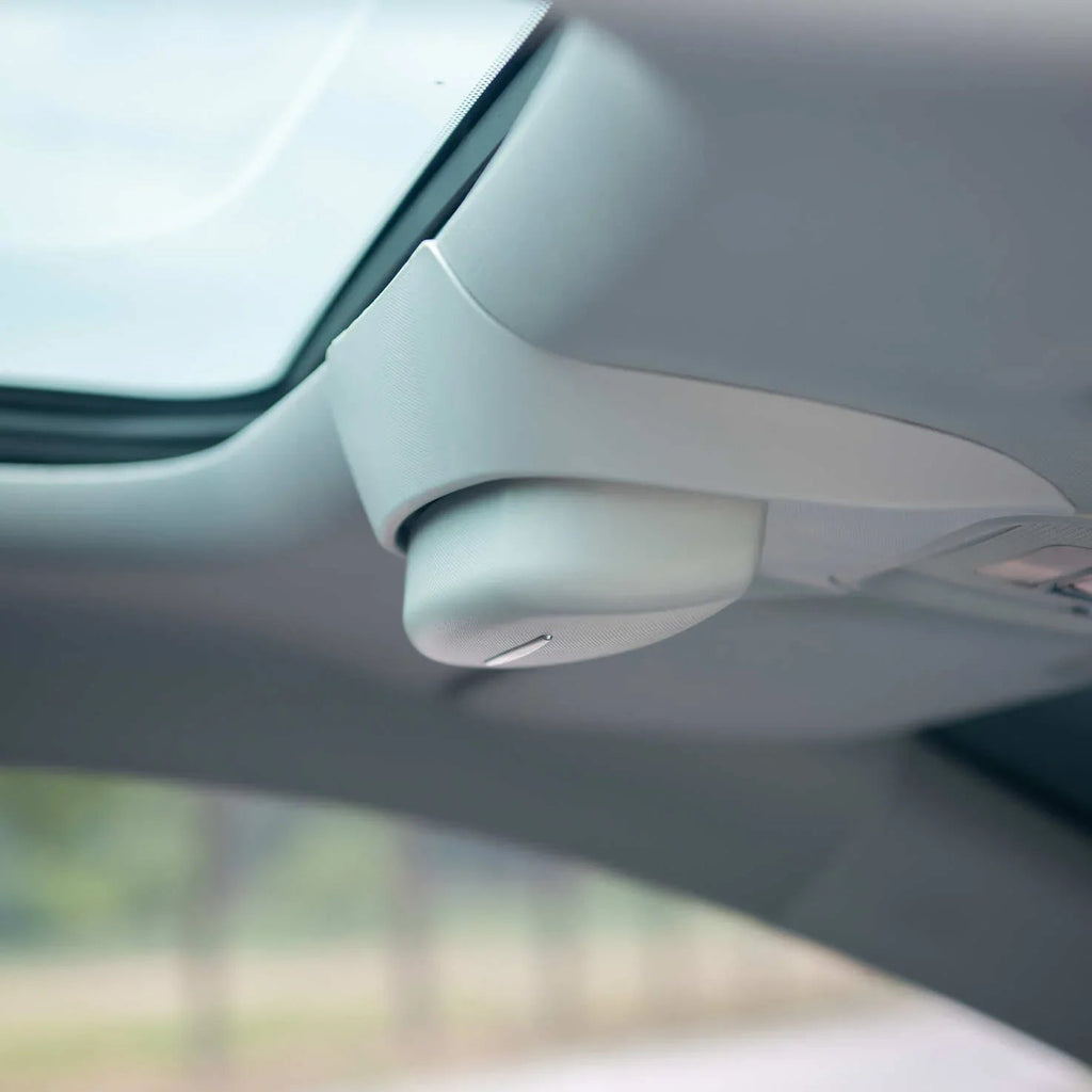 Gray premium textured interior trim component installed near the car sunroof.
