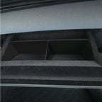 Black carpeted car trunk organizer with dividers for durable interior storage.