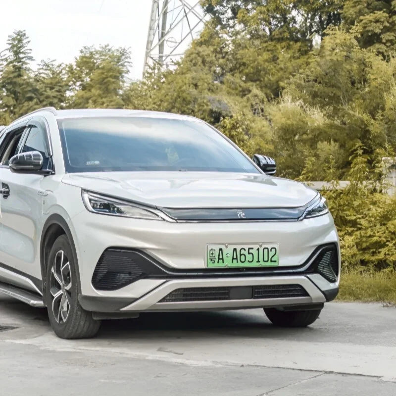 Silver BYD electric SUV featuring sleek aerodynamic design and modern front grille styling.