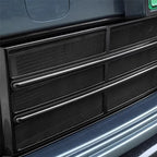 Black textured mesh protective grille cover for car interior trim.