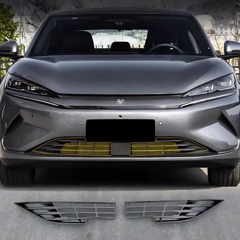 Glossy black ABS plastic front bumper grille covers for a grey BYD electric vehicle.