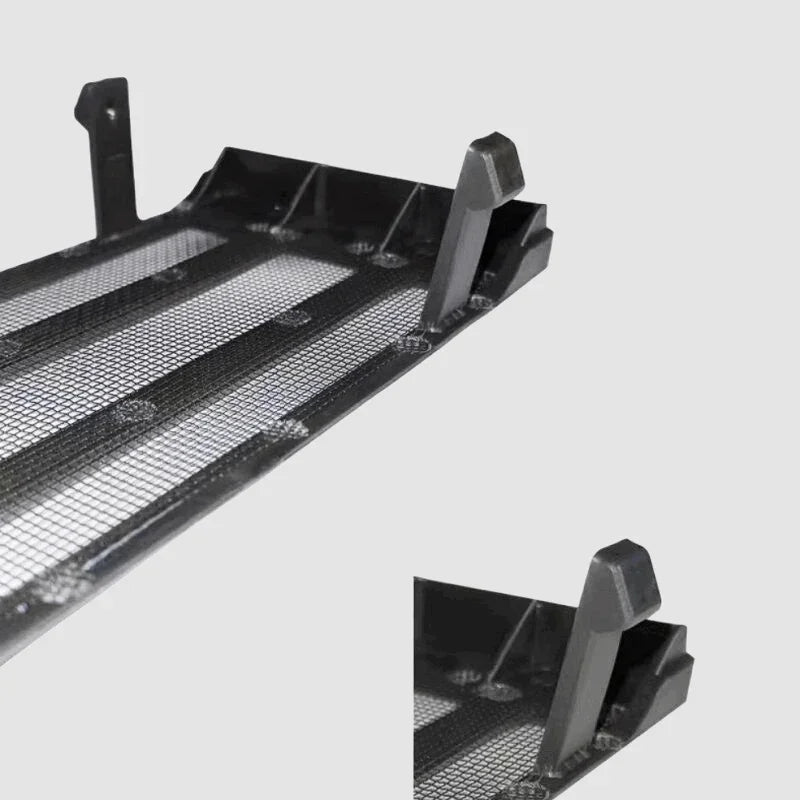 Close-up of a black durable plastic car cargo liner with a textured non-slip surface.