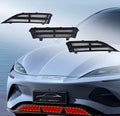 Black matte plastic front grille guards for BYD car, featuring a durable slotted design.