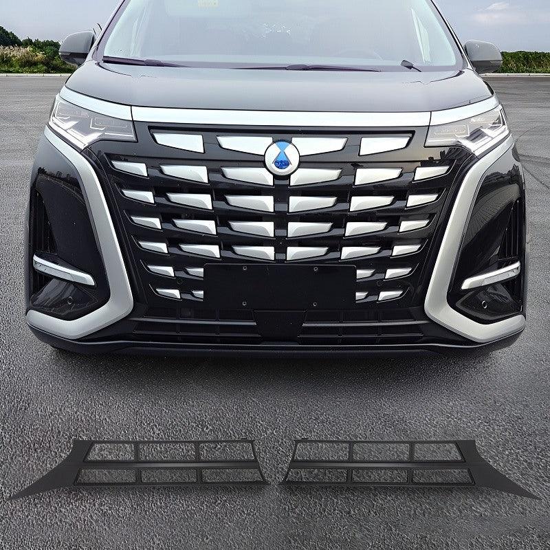 Black textured front grille protector covers for BYD vehicle front bumper.
