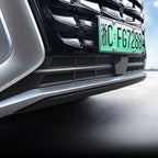 Black glossy front bumper grille with silver metallic trim accents on a vehicle.