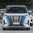 Front view of a white electric vehicle with a distinctive chrome grille and blue LED accents.