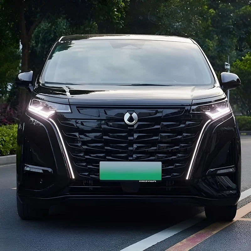 Front view of a sleek black Denza electric vehicle with a glossy finish and distinctive LED lights.