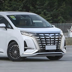 Front view of a white BYD MPV with a large black chrome grille and sleek LED headlights.