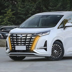 Front view of a white BYD electric minivan featuring sleek LED headlights and a modern chrome grille.