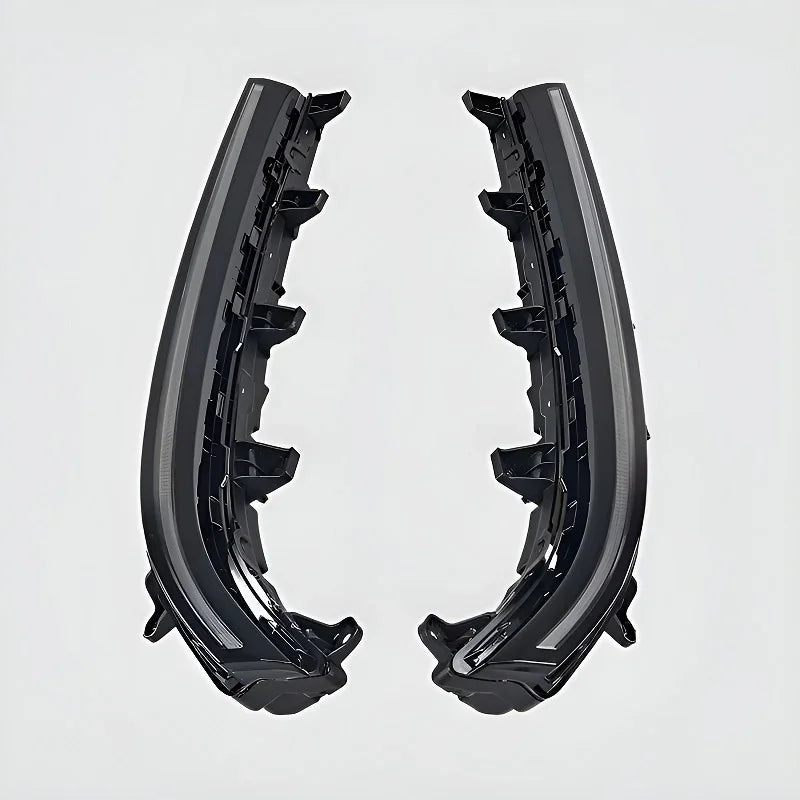 Pair of durable black plastic car door sill protectors with structured reinforced edges.