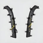Pair of professional black plastic side skirts with integrated yellow wiring harnesses.