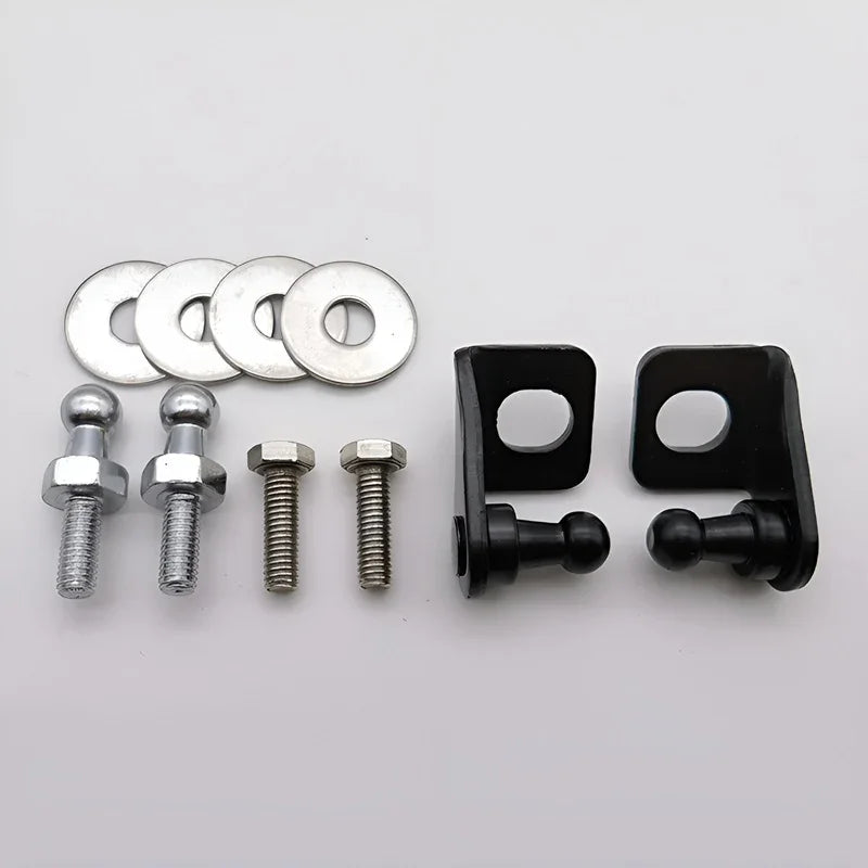 Set of black door hinge pins, silver metal washers, and bolts for automotive repair.