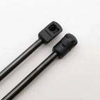 Two black metal rods with specialized square and rounded plastic end connectors.