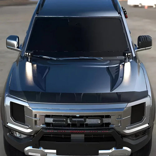 Front view of a dark grey BYD vehicle featuring a custom matte black hood protector and chrome grille.