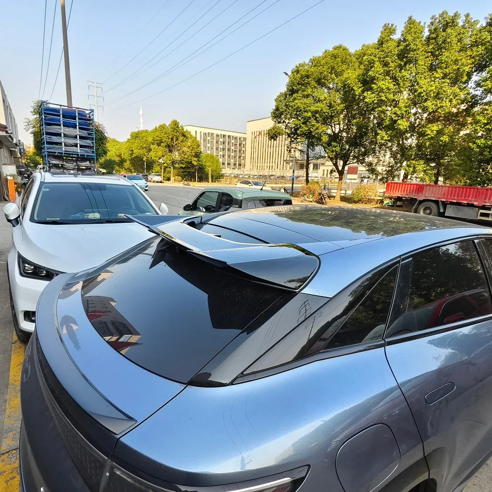 Sleek matte blue rear spoiler accessory for BYD, featuring a high-gloss aerodynamic design.