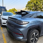 Black aerodynamic rear spoiler installed on a blue BYD electric vehicle.