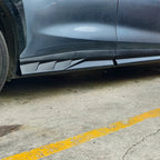 Matte black aerodynamic side skirt extension for BYD, made of durable composite material.