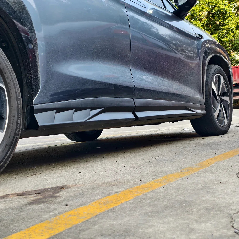 Black matte side skirt protector installed on a dark grey BYD vehicle for enhanced body protection.
