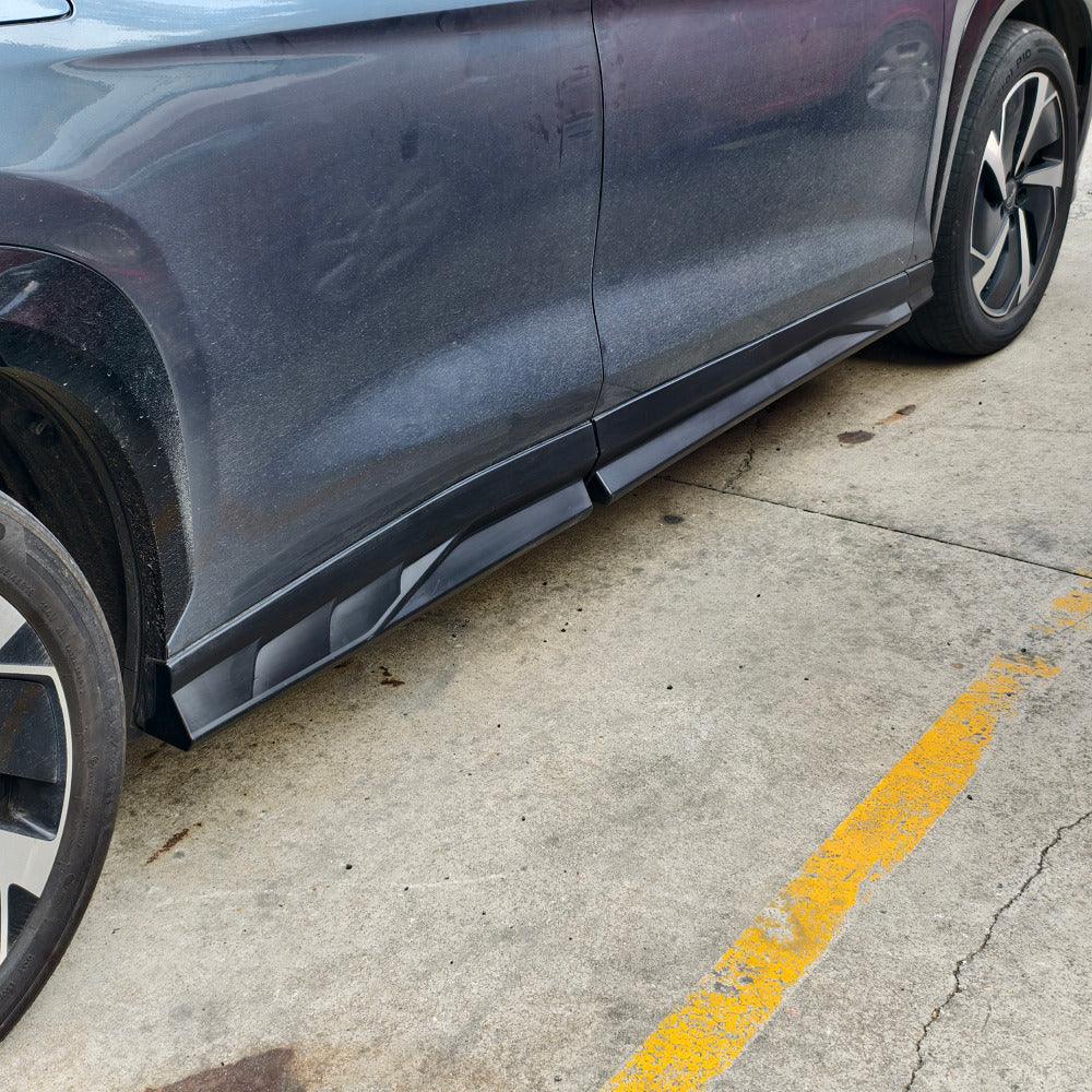 Black matte textured side skirt protector installed on a dark grey BYD vehicle for enhanced durability.