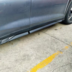 Black matte side skirt protector installed on a dark grey BYD vehicle body.